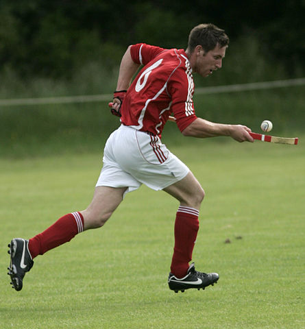 Balancing a ball on a stick while running seems like an overly-complicated way of getting it from A to B. (Photo: Alasdair Middleton/wikimedia)