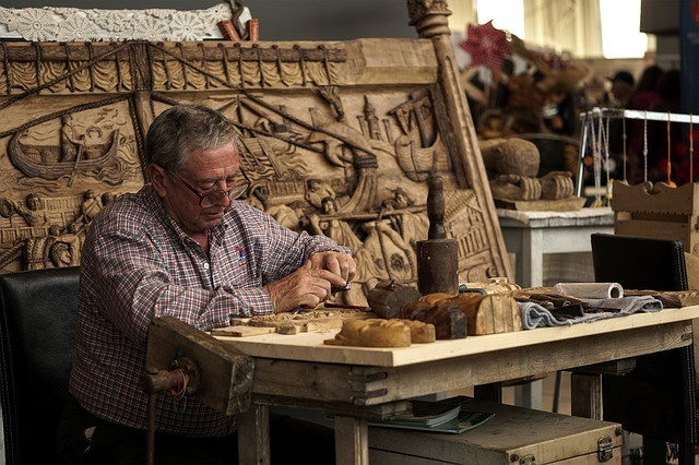 A woodworker working on wood.