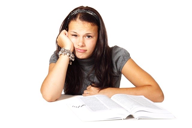 A girl wearing a bored expression.