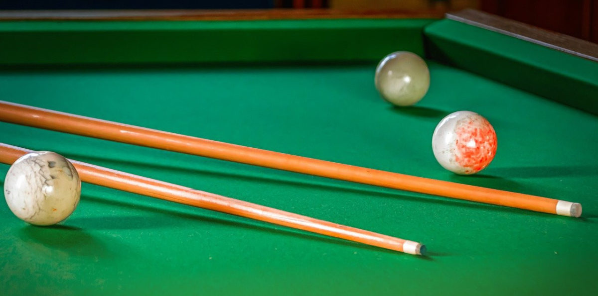 Billiards balls and cues.